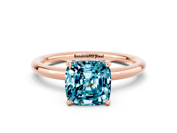 Rose gold Cushion Cut Blue Topaz Solitaire Ring with Thin Band and Four-Prong Setting