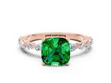 Rose gold Cushion Cut Emerald Solitaire with Side Stones on a Pavé Band and Four-Prong Setting