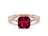 Rose gold Cushion Cut Garnet Solitaire with Side Stones on a Pavé Band and Four-Prong Setting
