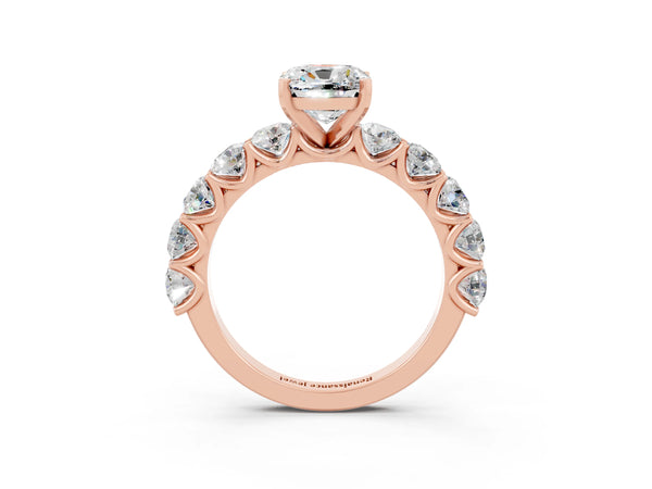 Rose gold Cushion Cut Moissanite Prong Setting with Side Stones on a Pave Band