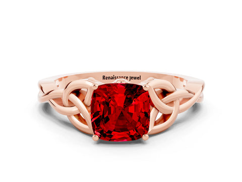 Rose gold Cushion Cut Ruby Solitaire Engagement Ring with Celtic Knot Band and Four-Prong Setting
