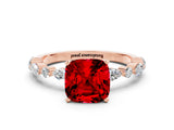 Rose gold Cushion Cut Ruby Solitaire with Side Stones on a Pavé Band and Four-Prong Setting
