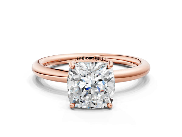 Rose gold Cushion Solitaire Diamond Ring with Four-Prong Setting on a Plain Band