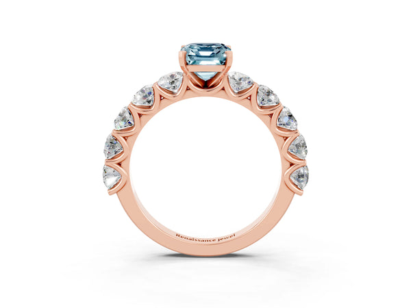 Rose gold Emerald Cut Aquamarine Prong Setting with Side Stones on a Pave Band