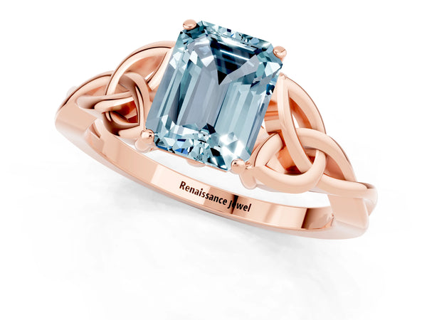Rose gold Emerald Cut Aquamarine Solitaire Engagement Ring with Celtic Knot Band and Four-Prong Setting