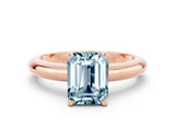 Rose gold Emerald Cut Aquamarine Solitaire Engagement Ring with Round Band and Four-Prong Setting