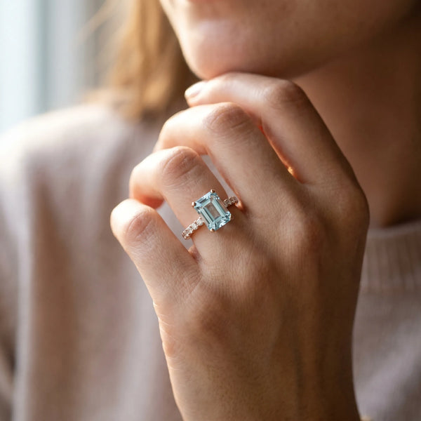 Rose gold Emerald Cut Aquamarine Solitaire Ring with Round  Pavé Band and Four-Prong Setting