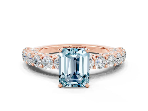 Rose gold Emerald Cut Aquamarine Solitaire Ring with Shared Prong Pavé Band and Four-Prong Setting