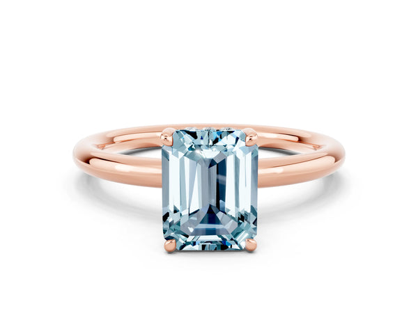 Rose gold Emerald Cut Aquamarine Solitaire Ring with Thin Band and Four-Prong Setting