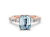 Rose gold Emerald Cut Aquamarine Solitaire with Side Baguettes and Channel Set Band