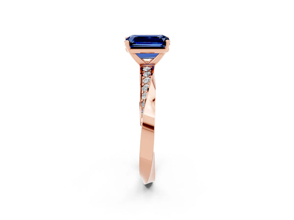 Rose gold Emerald Cut Blue Sapphire Engagement Ring with Side Stone Accents and Four-Prong Setting