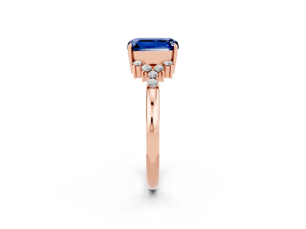 Rose gold Emerald Cut Blue Sapphire Ring with Side Stones and Four-Prong Setting
