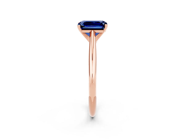 Rose gold Emerald Cut Blue Sapphire Solitaire Engagement Ring with Cathedral Setting and Four-Prong Mount