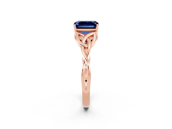 Rose gold Emerald Cut Blue Sapphire Solitaire Engagement Ring with Celtic Knot Band and Four-Prong Setting
