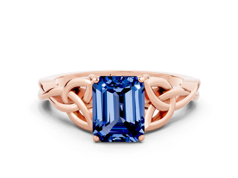 Rose gold Emerald Cut Blue Sapphire Solitaire Engagement Ring with Celtic Knot Band and Four-Prong Setting