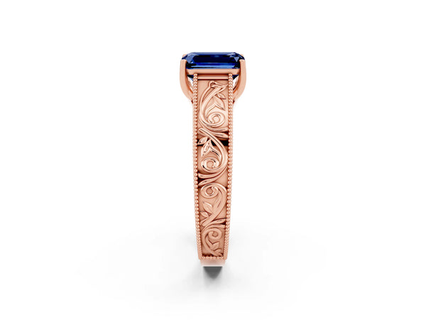 Rose gold Emerald Cut Blue Sapphire Solitaire Ring with Engraved Band and Four-Prong Setting