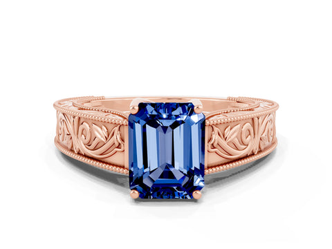 Rose gold Emerald Cut Blue Sapphire Solitaire Ring with Engraved Band and Four-Prong Setting