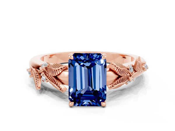 Rose gold Emerald Cut Blue Sapphire Solitaire Ring with Leaf Motif Band and Four-Prong Setting
