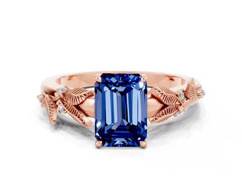 Rose gold Emerald Cut Blue Sapphire Solitaire Ring with Leaf Motif Band and Four-Prong Setting