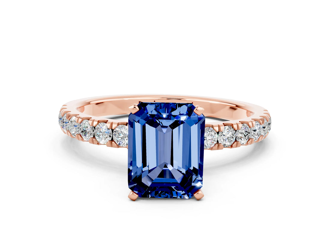 Rose gold Emerald Cut Blue Sapphire Solitaire Ring with Pavé Accents and Four-Prong Setting
