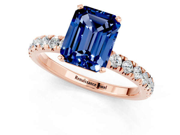 Rose gold Emerald Cut Blue Sapphire Solitaire Ring with Pavé Accents and Four-Prong Setting