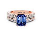Rose gold Emerald Cut Blue Sapphire Solitaire Ring with Pavé and Channel Set Band
