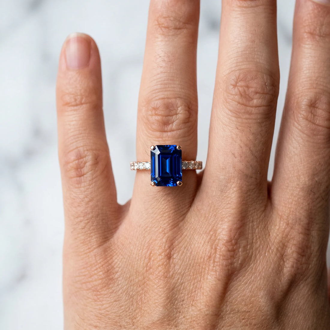 Rose gold Emerald Cut Blue Sapphire Solitaire Ring with Round  Pavé Band and Four-Prong Setting_42