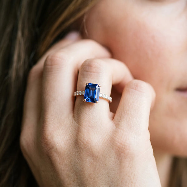Rose gold Emerald Cut Blue Sapphire Solitaire Ring with Round  Pavé Band and Four-Prong Setting