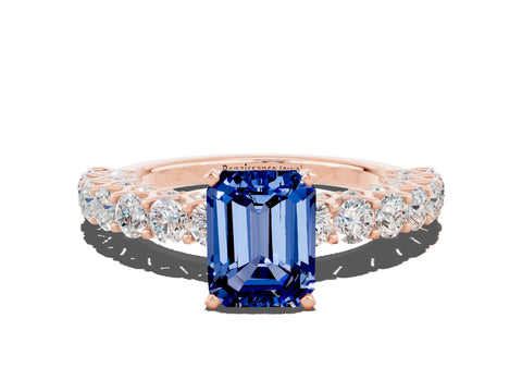 Rose gold Emerald Cut Blue Sapphire Solitaire Ring with Shared Prong Pavé Band and Four-Prong Setting