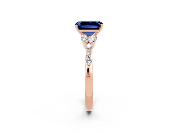 Rose gold Emerald Cut Blue Sapphire Solitaire Ring with Side Stones and Four-Prong Setting
