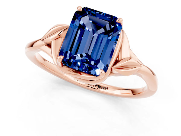 Rose gold Emerald Cut Blue Sapphire Solitaire Ring with Twist Band and Four-Prong Setting