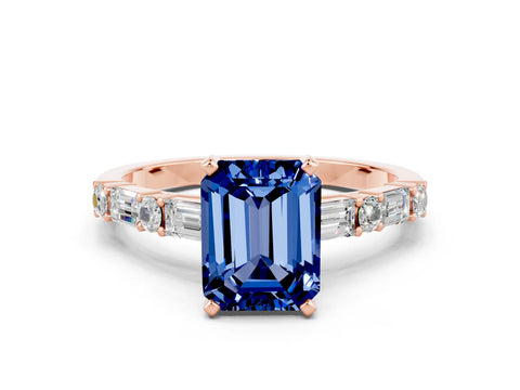 Rose gold Emerald Cut Blue Sapphire Solitaire with Side Baguettes and Channel Set Band
