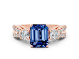 Rose gold Emerald Cut Blue Sapphire Three-Stone Ring with Pavé Split Shank and Four-Prong Setting