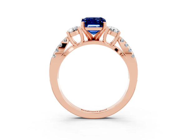Rose gold Emerald Cut Blue Sapphire Three-Stone Ring with Pavé Split Shank and Four-Prong Setting
