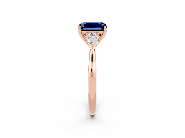 Rose gold Emerald Cut Blue Sapphire Three-Stone Ring with Pear  Side Stones and Prong Setting