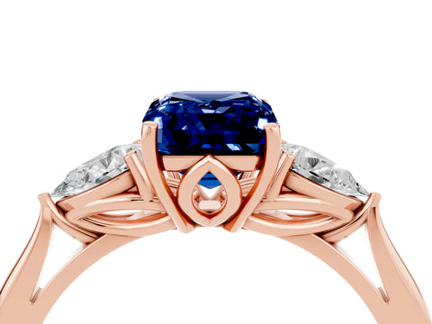 Rose gold Emerald Cut Blue Sapphire Three-Stone Ring with Pear Side Stones and Four-Prong Setting_16