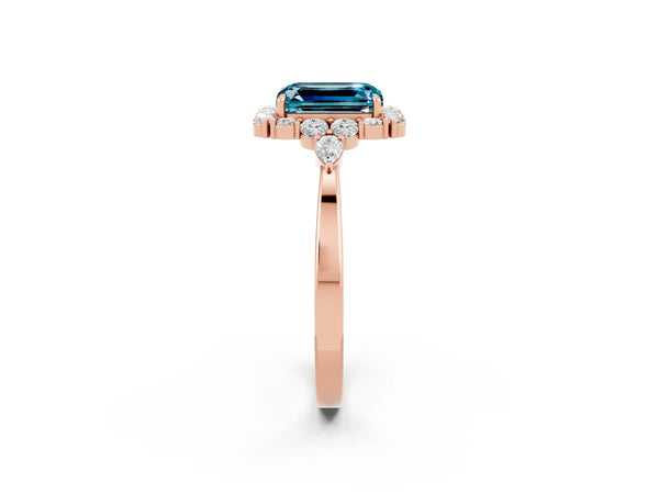 Rose gold Emerald Cut Blue Topaz Halo Ring with Pear Side Stones and Prong Setting