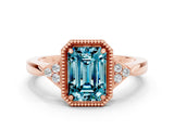 Rose gold Emerald Cut Blue Topaz Halo Ring with Tapered Band and Four-Prong Setting