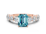 Rose gold Emerald Cut Blue Topaz Prong Setting with Side Stones on a Pave Band