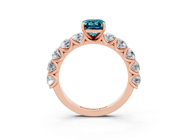 Rose gold Emerald Cut Blue Topaz Prong Setting with Side Stones on a Pave Band