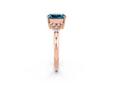 Rose gold Emerald Cut Blue Topaz Ring with Side Stones and Four-Prong Setting_38