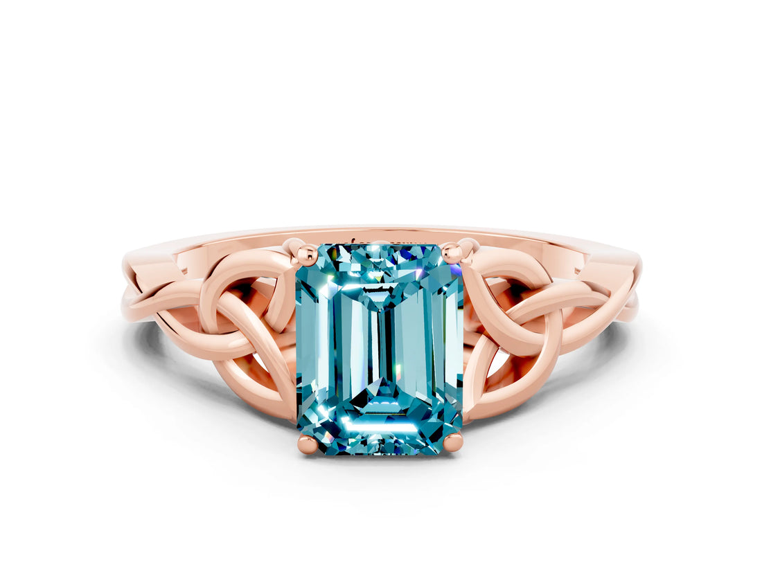 Rose gold Emerald Cut Blue Topaz Solitaire Engagement Ring with Celtic Knot Band and Four-Prong Setting
