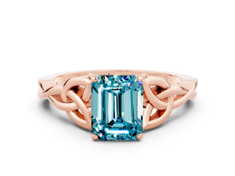 Rose gold Emerald Cut Blue Topaz Solitaire Engagement Ring with Celtic Knot Band and Four-Prong Setting