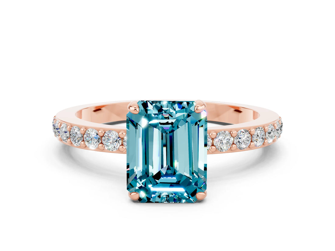 Rose gold Emerald Cut Blue Topaz Solitaire Engagement Ring with Pavé Band and Four-Prong Setting