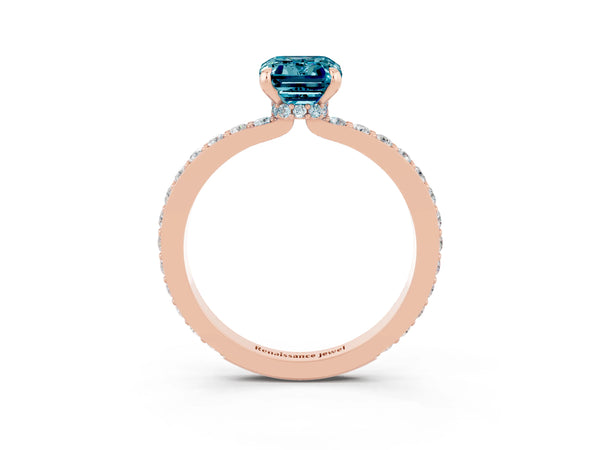Rose gold Emerald Cut Blue Topaz Solitaire Engagement Ring with Pavé Band and Four-Prong Setting