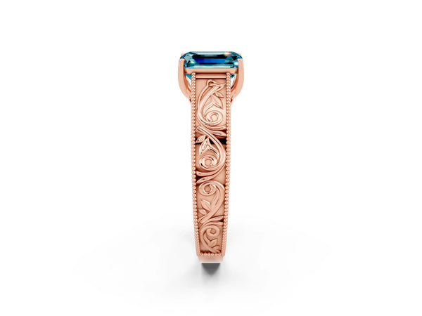 Rose gold Emerald Cut Blue Topaz Solitaire Ring with Engraved Band and Four-Prong Setting