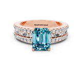 Rose gold Emerald Cut Blue Topaz Solitaire Ring with Pavé and Channel Set Band