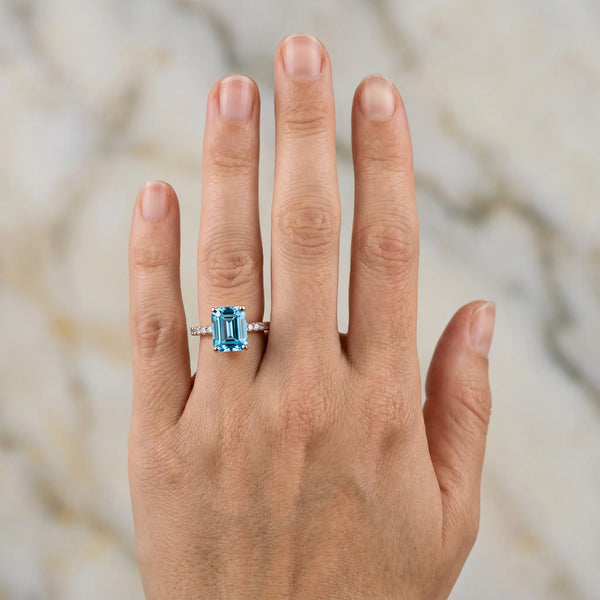Rose gold Emerald Cut Blue Topaz Solitaire Ring with Round  Pavé Band and Four-Prong Setting