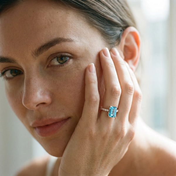 Rose gold Emerald Cut Blue Topaz Solitaire Ring with Round  Pavé Band and Four-Prong Setting