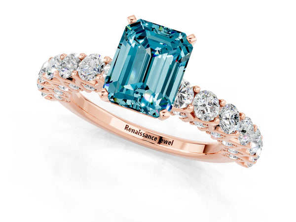 Rose gold Emerald Cut Blue Topaz Solitaire Ring with Shared Prong Pavé Band and Four-Prong Setting